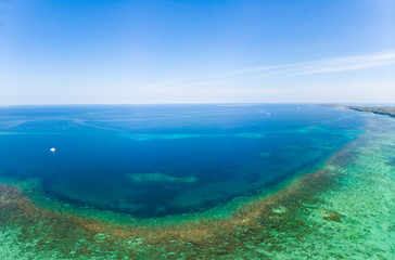 Naklejka premium Aerial view coral reef scattered in caribbean sea, tropical beach islands. Indonesia Moluccas archipelago, Kei Islands, Banda Sea. Top travel destination, best diving snorkeling, stunning panorama.