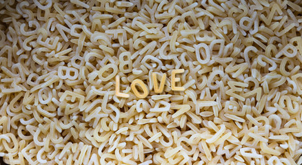 pasta, light background. lined with pasta with the letters 
