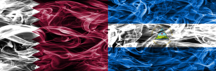 Obraz premium Qatar vs Nicaragua, Nicaraguan smoke flags placed side by side. United Arab Emirates. UAE.