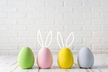 Four eggs for Easter with funny bunny ears
