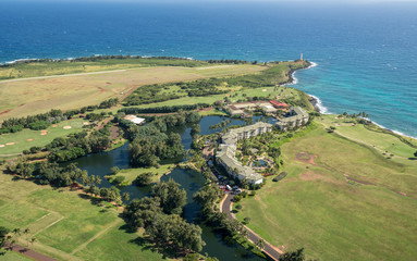 Aerial view of hotel and landscape of hawaiian island of Kauai from helicopter flight