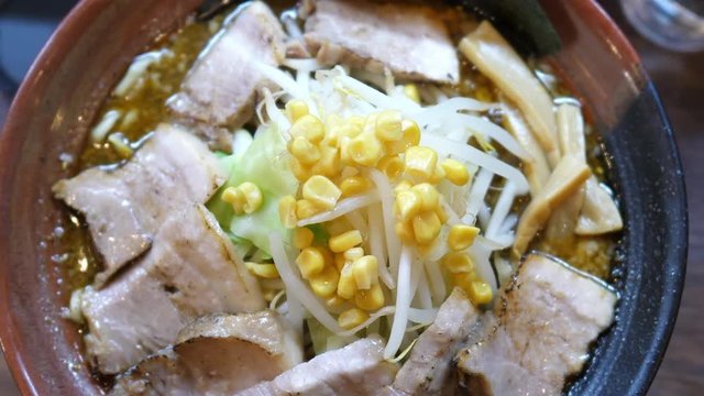 Japanese cuisine: Delicious miso (soybean paste) ramen noodles, top view. Shot in 4K