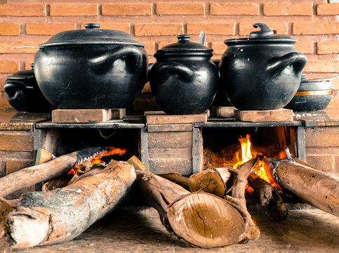 Traditional Brazilian food of Minas Gerais region being prepared in popular wood stove and clay pots - S&atilde;o Thom&eacute; das Letras