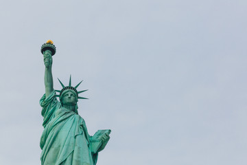 Fototapeta premium Statue of Liberty against sky and clouds, in New York City, USA