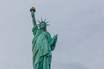 Fototapeta premium Statue of Liberty against sky and clouds, in New York City, USA