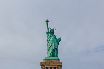 Fototapeta premium Statue of Liberty against sky and clouds, in New York City, USA