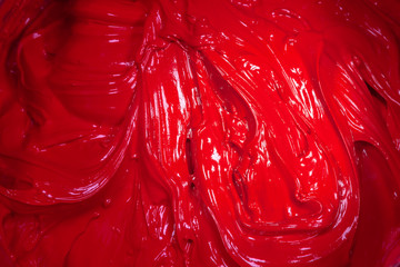 close up red color of oil paint. ink of screen printing  for print on tee shirts and fabric