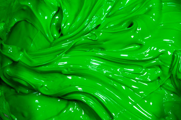 close up ufo green color of oil paint. ink of screen printing  for print on tee shirts and fabric