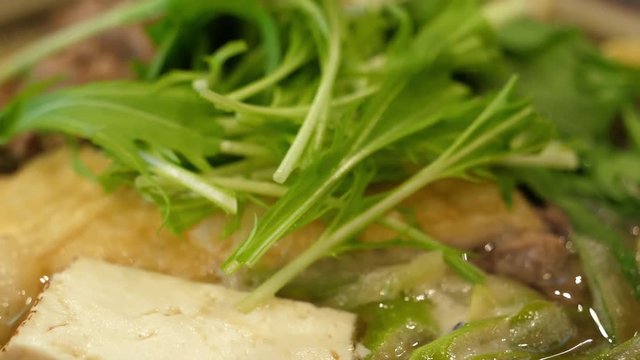 Japanese food: Chanko nabe soup, extreme close up. Shot in 4K