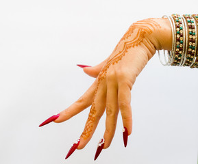 nails decorated with brilliant and hand with henna tattoos