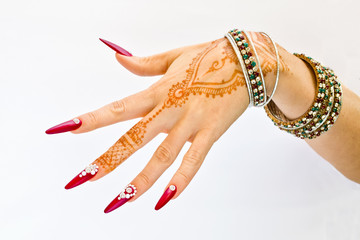 nails decorated with brilliant and hand with henna tattoos