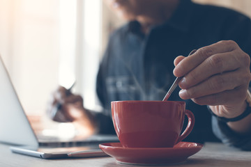 Man working and drinking coffee