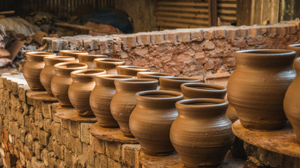 ceramic pot outside under the sun in the dharavi slum in bombay india