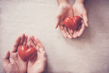 hands and red heart, health insurance, donation and charity, social distancing concept - obrazy, fototapety, plakaty