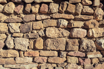 Fototapeta premium Ancient stone wall, hand work
