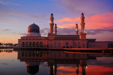 Outstanding pink and purple sunset against the City Mosque in Sabah, Kota Kinabalu, Malaysia on the...
