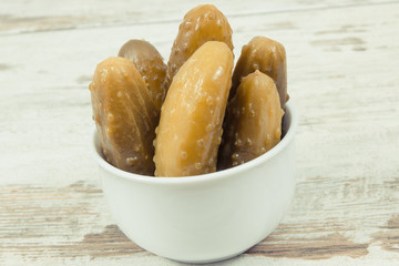 Fresh homemade pickled cucumbers in white bowl