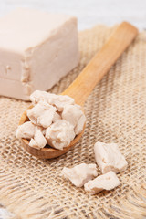 Fresh crumbled yeast for baking or preparing sourdough