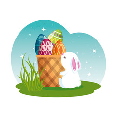 cute rabbit with easter eggs painted in basket