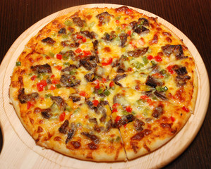 pizza on a wooden deck