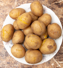 Boiled potatoes in a plate on the table