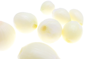Peeled onions on a white background