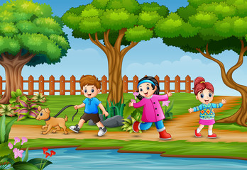 Obraz na płótnie Canvas Happy children running around in beautiful nature