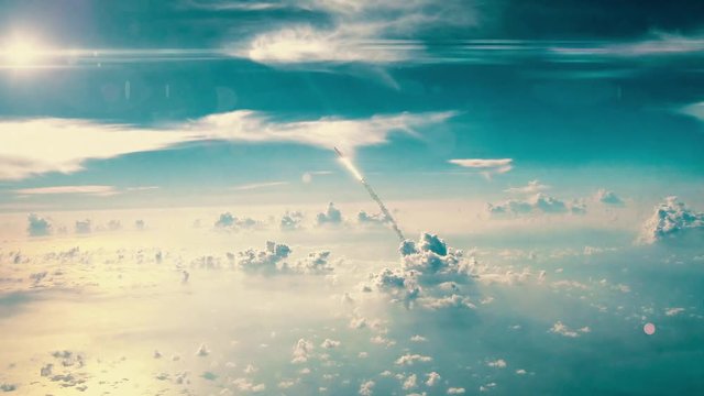 Rocket leaving the atmosphere, nuclear missile flying through blue sky with exhaust flames and smoke.