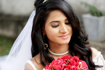 Beautiful young bride with wedding makeup and hairstyle