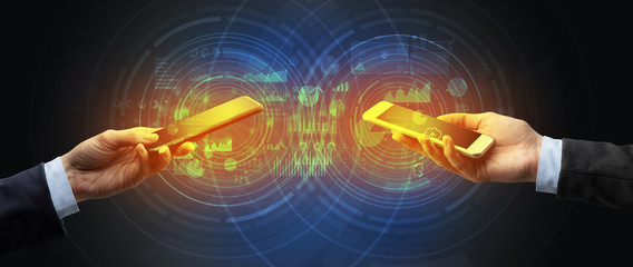 Close up of two smartphones syncing business data