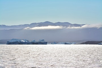 Disko Bay, Greenland - July - boat trip in the morning over the arctic sea - cold and fresh air and big beautiful icebergs, quiet moments in a wonderful nature
