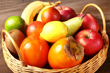 Fresh mixed exotic fruits in basket. Fruits background. Healthy eating, dieting.