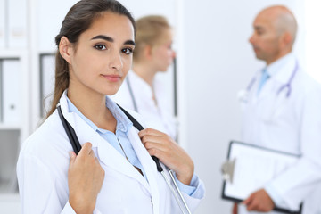 Portrait of young doctor woman  in hospital. Hispanic or latin american staff in medicine