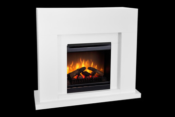 White wooden burning fireplace with roaring flames. Isolated on black background, clipping path included. Modern design fireplace as a piece of furniture