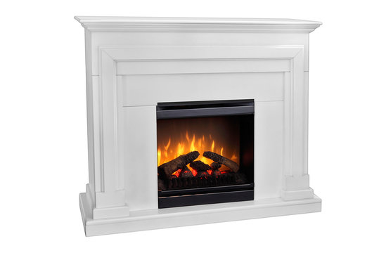 White wooden fireplace with roaring flames, classic elegant design. Isolated on white background, clipping path included. Fireplace as a piece of furniture