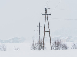 Power lines in the snowstorm in Ebbs, Tirol, Austria