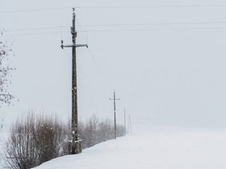 Power lines in the snowstorm in Ebbs, Tirol, Austria