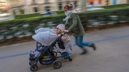 Panning mom on the run with a stroller- Barcelona Spain