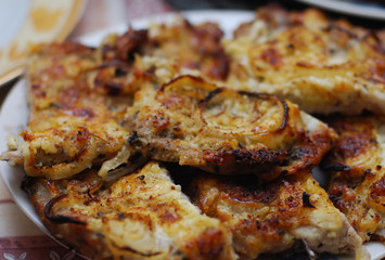 Pork fried in egg and flour with onions