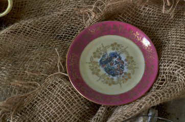 porcelain saucer in the dust