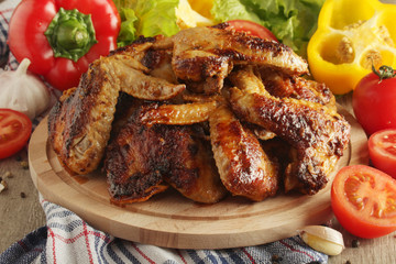 Chicken wings barbecue with different vegetables	