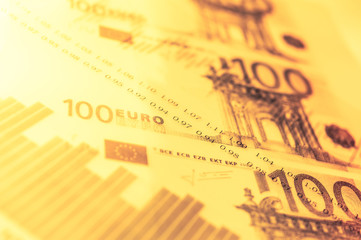 Double exposure Stock market display or forex trading graph and candlestick chart on euro banknote