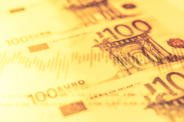 Double exposure Stock market display or forex trading graph and candlestick chart on euro banknote