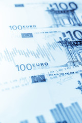 Double exposure Stock market display or forex trading graph and candlestick chart on euro banknote