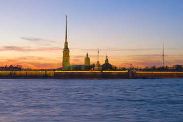 View of the Peter and Paul Fortress against the sunset sky on May evening. Saint-Petersburg, Russia