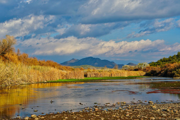 River Landscape with Mountains