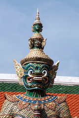 Bangkok Thailand, Giant demon guardian at the Grand Palace and Wat Phra Kaew with 3 stacked heads