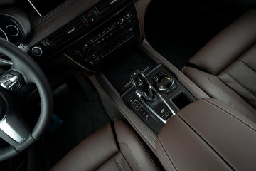 Modern luxury car Interior - steering wheel, shift lever and dashboard. Car interior luxury inside....
