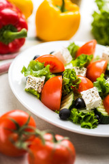 fresh greek salad with tomatoes and mozzarella