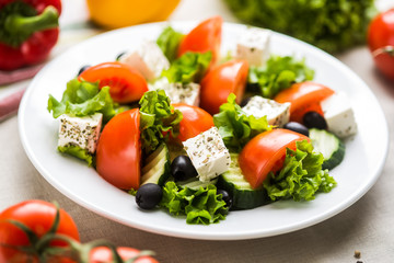 fresh greek salad with tomatoes and mozzarella